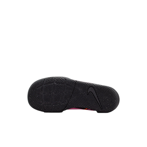 The black textured outsole of a Nike athletic shoe, featuring a prominent swoosh logo on the heel and a complex traction pattern.