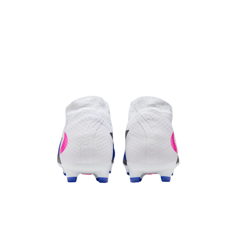 Rear view of a pair of white soccer cleats with pink and blue accents, isolated on a black background.