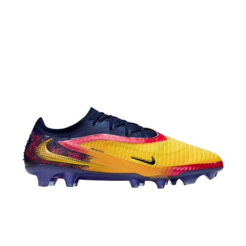 Nike Phantom GX soccer cleat featuring a vibrant yellow, orange, and navy blue gradient design with gold accents, set against a solid black background.