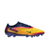 Nike Phantom GX soccer cleat featuring a vibrant yellow, orange, and navy blue gradient design with gold accents, set against a solid black background.