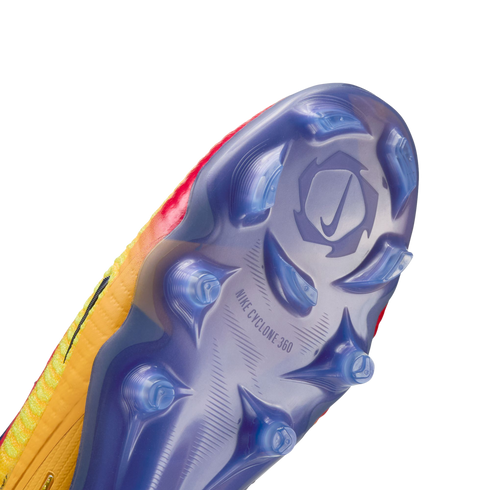 Close-up of a translucent blue Nike soccer cleat sole plate with clear studs and "NIKE CYCLONE 360" text against a black background.