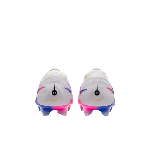 Rear view of two white soccer cleats with pink and blue gradient soles. Each heel features a black logo and "Maestro" written in gold cursive script.