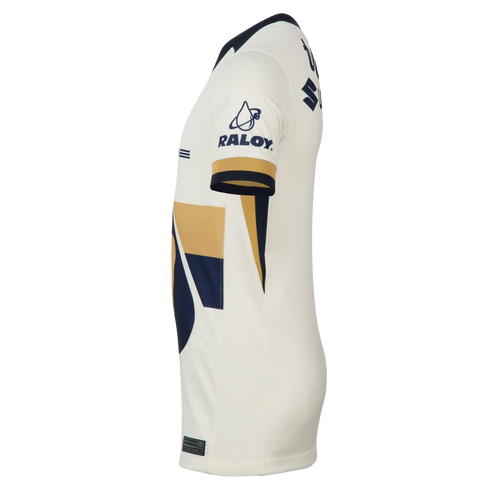 Side view of a white Pumas UNAM soccer jersey with navy and gold accents. Features a 'RALOY' logo on the sleeve and a partial puma face emblem on the front.