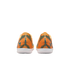 Back view of orange Nike Mercurial soccer shoes featuring blue diagonal stripes, white soles, and "KM" branding on the heels.