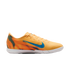 Bright orange Nike indoor soccer shoe with a blue swoosh and flame-patterned heel on a black background.
