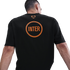 Back view of a man wearing a black Nike t-shirt with a large orange "INTER" graphic inside a circle and a small orange Nike logo at the neckline.