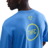 Back view of a person in a light blue t-shirt featuring a small yellow Nike logo and a larger yellow circular "THFC" graphic.