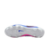 Underside of a Nike soccer cleat with a white soleplate, clear studs, a blue swoosh, and blue and pink accents on the upper.
