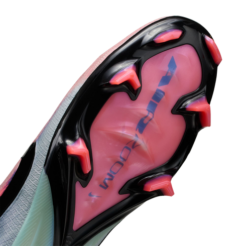 Bottom view of a soccer cleat soleplate featuring a black frame, pink translucent base with "AIR ZOOM" text, and bright pink studs against a black background.