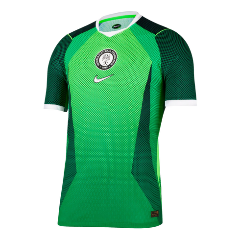 A green Nike Nigeria football jersey with dark green patterns, white trim, and the Nigeria Football Federation crest and Nike logo centered on the chest.