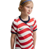A young girl in a red and white striped USA soccer jersey and blue headband, set against a black background.