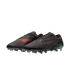 A pair of black Nike soccer cleats with orange accents and iridescent green swooshes against a black background.