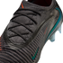 Close-up of a dark grey Nike soccer cleat with a textured knit upper, black laces, and an iridescent Nike swoosh on the side.