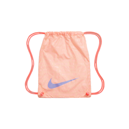 A pink Nike drawstring gym bag with a light blue swoosh logo and repeating text pattern, set against a black background.