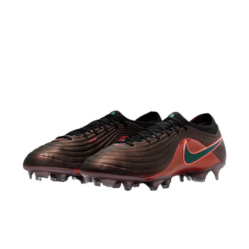 A pair of iridescent dark brown Nike soccer cleats with a wavy texture, black laces, and a teal swoosh outlined in red.