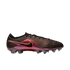 A side view of a Nike soccer cleat with an iridescent purple and bronze upper, wavy grooves, a red Nike swoosh, and translucent studs on a black background.