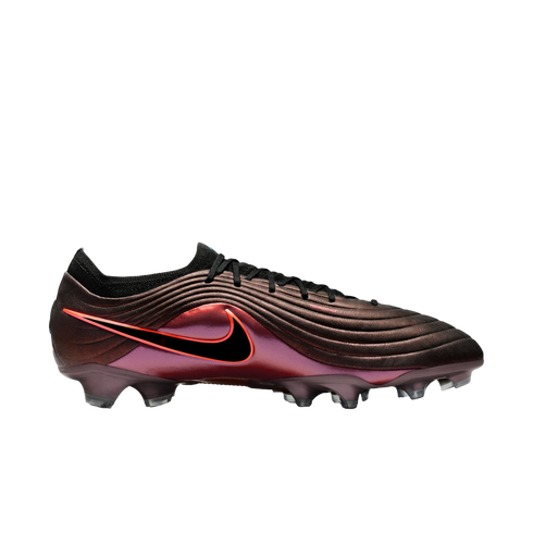 Side profile of a Nike soccer cleat with an iridescent metallic purple finish, a ribbed upper, and a black swoosh with a red outline.
