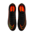 Top-down view of a pair of black Nike Mercurial soccer cleats with orange accents and iridescent Nike swooshes.