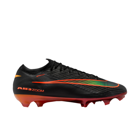 Black Nike soccer cleat featuring an iridescent green and orange swoosh and a red-orange gradient sole with studs.