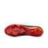 Bottom view of a Nike Air Zoom Mercurial football boot soleplate, featuring metallic red and orange colors with black accents and triangular studs on a black background.