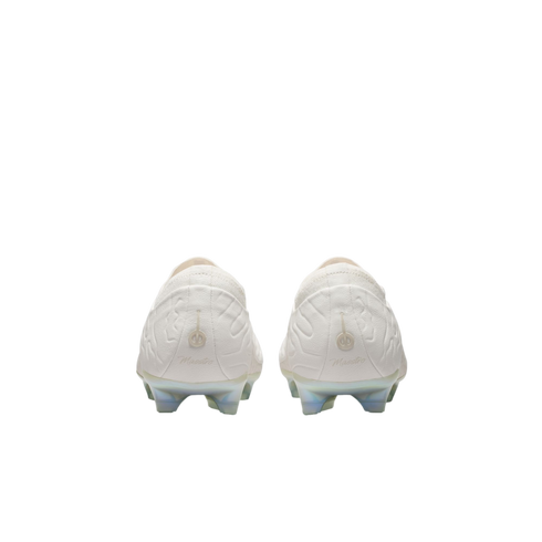 Rear view of white soccer cleats featuring "Maestro" text on the heels, an embossed upper pattern, and iridescent studs.
