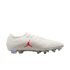 Side view of an off-white Jordan soccer cleat with a red Jumpman logo on a grey patterned midfoot and translucent studs.