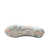 The sole of a Nike x Jordan soccer cleat featuring iridescent plates, molded studs, a red Jumpman logo, and a white swoosh against a gray patterned upper.
