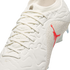 Close-up of a white Jordan Brand soccer cleat with a red Jumpman logo and grey elephant print pattern on the side.