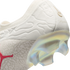 Close-up of a white Puma soccer cleat heel with a textured upper, a red Puma logo, and a semi-translucent iridescent soleplate with studs.
