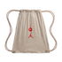 Beige suede drawstring backpack with thin rope straps. Features red embroidered Jordan Brand Jumpman and circular logos on the front center.