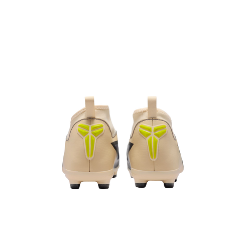 Back view of a pair of light beige soccer cleats featuring bright yellow Kobe logos on the heels, set against a black background.