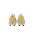 Back view of a pair of light beige soccer cleats featuring bright yellow Kobe logos on the heels, set against a black background.