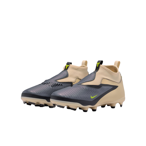Pair of laceless Nike football boots with a tan sock-like upper and iridescent grey textured overlays. Highlights include neon green accents and a tan soleplate with black studs.