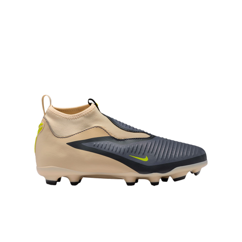 Side view of a laceless Nike soccer cleat in tan and charcoal gray with neon yellow accents. Features a high-top collar and textured upper, displayed against a solid black background.