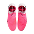 Top-down view of pink Nike Phantom soccer boots with white collars and black swooshes. The pink insoles feature the word "PHANTO" in white text.