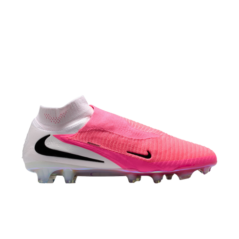Side view of a pink and white Nike high-top soccer cleat with a textured upper, black Nike swoosh, and translucent soleplate on a white background.