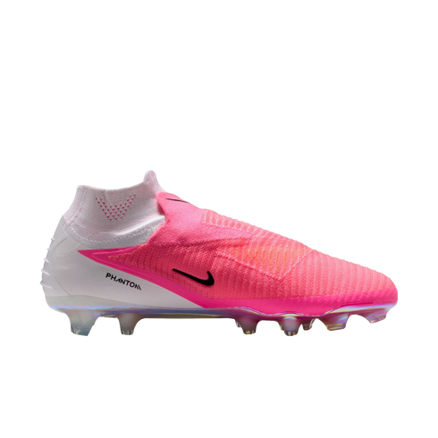 A side view of a pink and white Nike Phantom laceless soccer cleat with a high-top collar and iridescent studs.