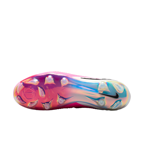 The sole of a pink Nike soccer cleat with an iridescent pink-to-blue gradient finish, clear studs, and a black Nike swoosh.