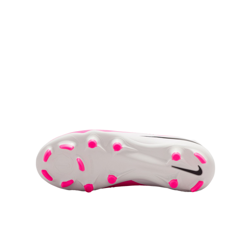 Bottom view of a white Nike soccer cleat with bright pink studs and a black Nike swoosh logo on the heel.