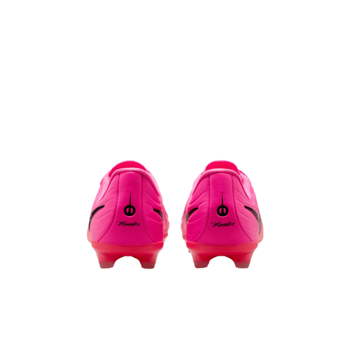 Rear view of a pair of bright pink soccer cleats with black "Maestro" branding on the heels and translucent red soles against a white background.