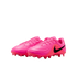 A pair of bright pink Nike soccer cleats with black swooshes and textured uppers on a white background.