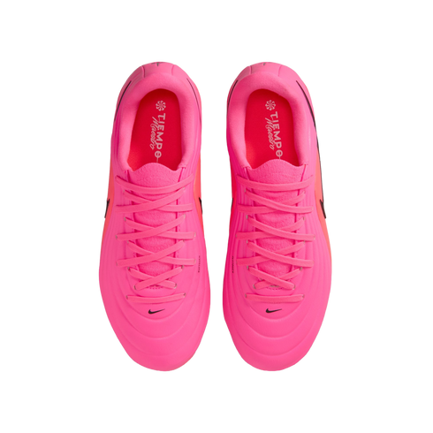 A top-down view of a pair of vibrant pink Nike Tiempo Maestro soccer cleats against a white background.