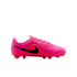 Profile of a bright pink Nike soccer cleat with a black swoosh and ridged upper. Includes pink laces and studs, set against a plain white background.
