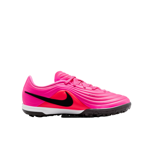 A vibrant pink and neon red Nike soccer shoe for artificial turf with a black Nike swoosh on the side and a black rubber outsole on a plain white background.