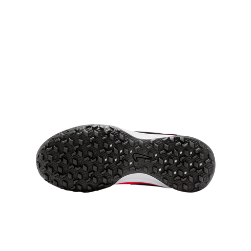 Bottom view of a black Nike shoe sole with a textured geometric tread pattern and a center swoosh logo, showing hints of a white and red midsole against a white background.
