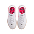 Top-down view of white Nike Tiempo Gato indoor soccer shoes with bright pink interiors, white laces, and gum outsoles.