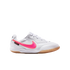 White Nike Tiempo indoor soccer shoe with a vibrant pink swoosh and a gum rubber outsole, shown in profile view against a white background.