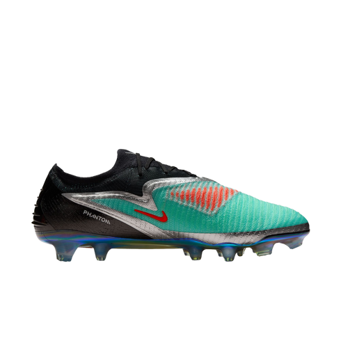 Side profile of a Nike Phantom soccer cleat with a teal and black upper, silver accents, and an iridescent sole plate on a white background.