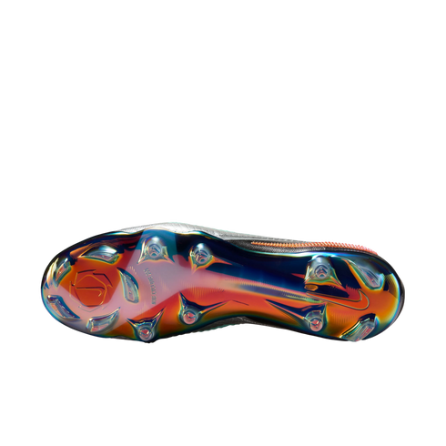 Bottom view of a Nike soccer cleat with an iridescent, multi-colored metallic sole plate and traction studs, set against a plain white background.