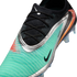 Close-up of a Nike soccer cleat with a teal textured upper, black lace area, metallic silver trim, and a large iridescent orange swoosh on the heel.